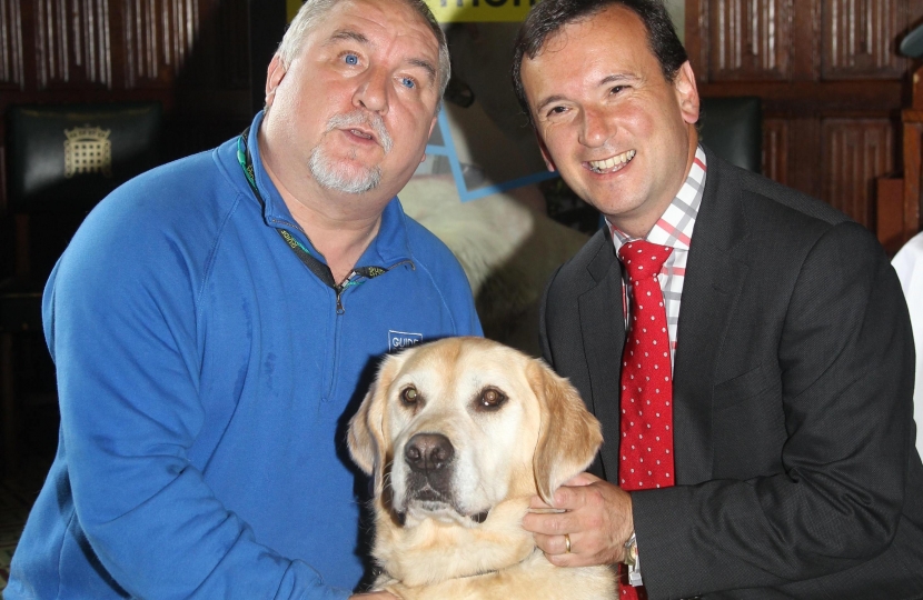 Alun Cairns MP and Guide Dog